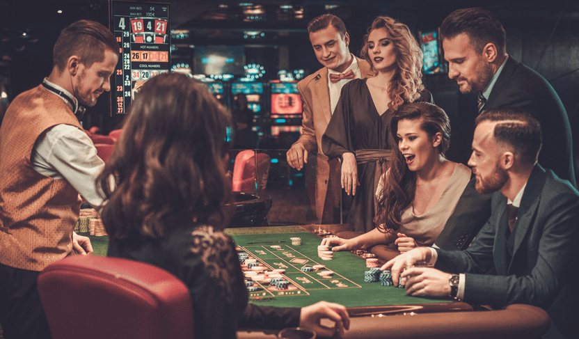 Casino players gambling at a table.