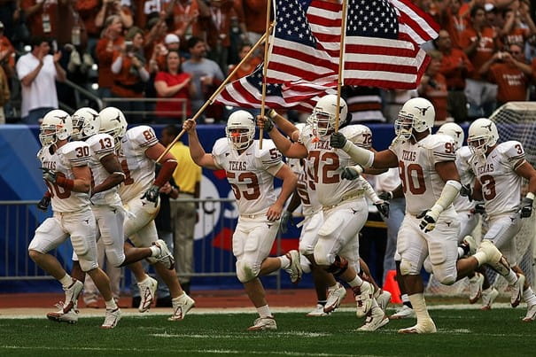 Texas Longhorns players running on to the field