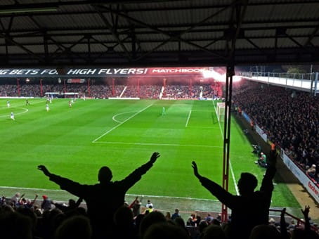 Fans watching Brentford FC who are owned by Mathew Benham